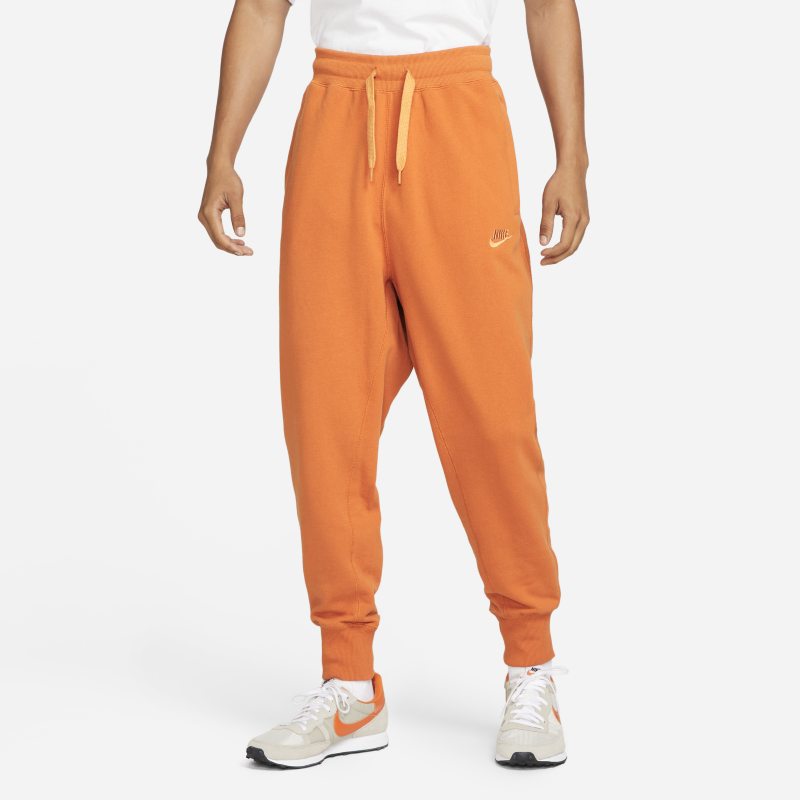 Męskie klasyczne spodnie z dzianiny Nike Sportswear - Pomarańczowy