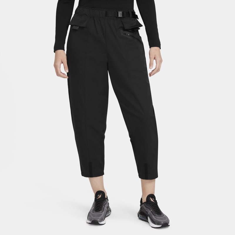 Damskie spodnie z tkaniny o kroju podkreślającym kształt ciała Nike Sportswear Tech Pack - Czerń