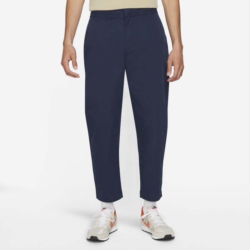 Męskie spodnie z tkaniny bez podszewki typu sneaker Nike Sportswear Style Essentials - Niebieski