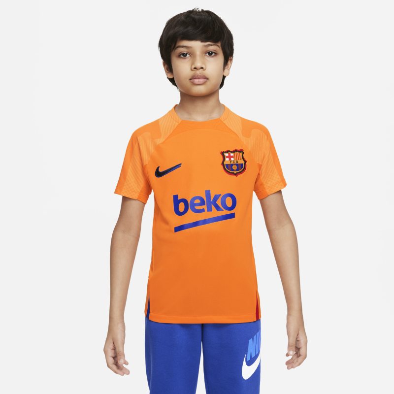 Koszulka piłkarska z krótkim rękawem dla dużych dzieci Nike Dri-FIT FC Barcelona Strike - Pomarańczowy