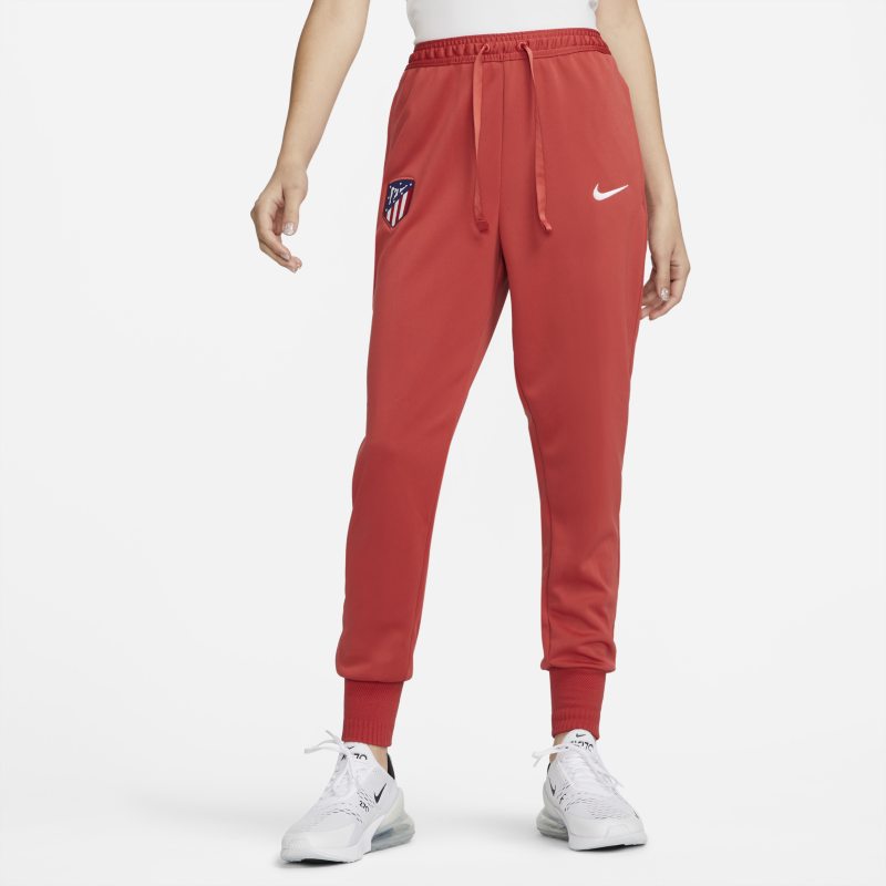 Damskie spodnie piłkarskie Nike Dri-FIT Atlético Madryt Travel - Czerwony