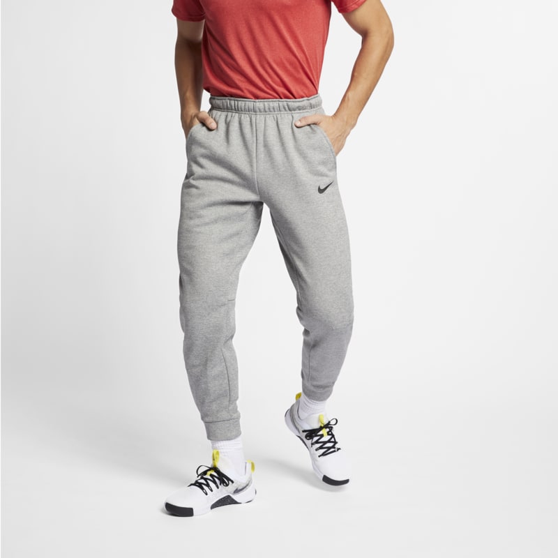 Avsmalnande träningsbyxor Nike Therma-FIT för män - Grå
