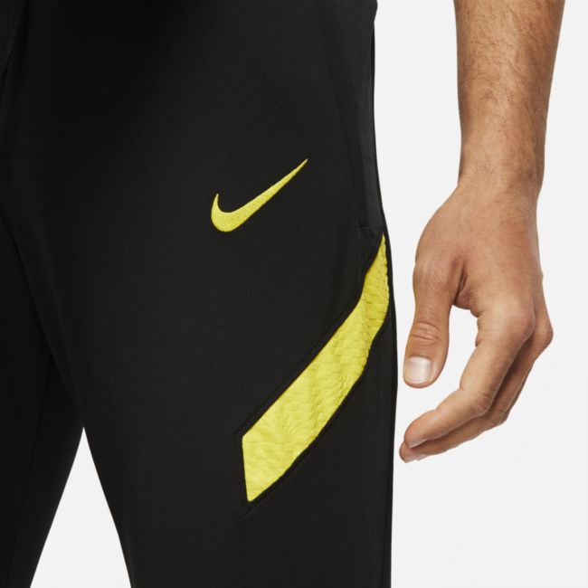 Męskie dzianinowe spodnie piłkarskie Nike Dri-FIT Chelsea FC Strike - Czerń