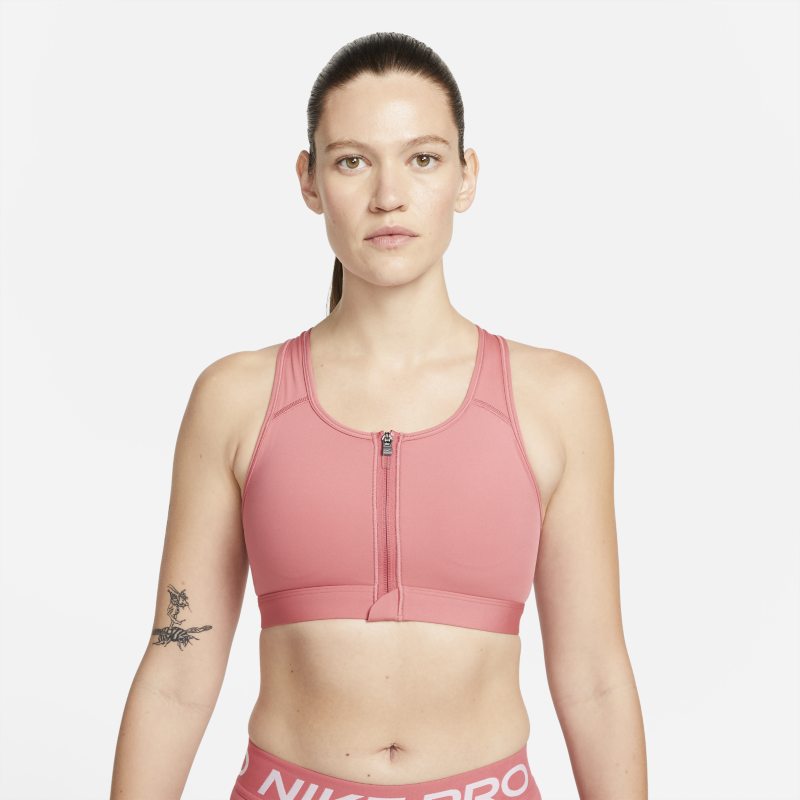 Nike Dri-FIT Swoosh Sujetador deportivo de sujeción media con almohadillas y cremallera delantera - Mujer - Rosa