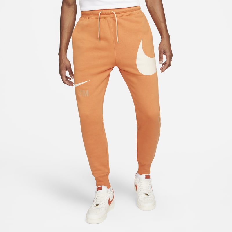 Nike Sportswear Swoosh Pantalón semicepillado en la parte posterior - Hombre - Naranja
